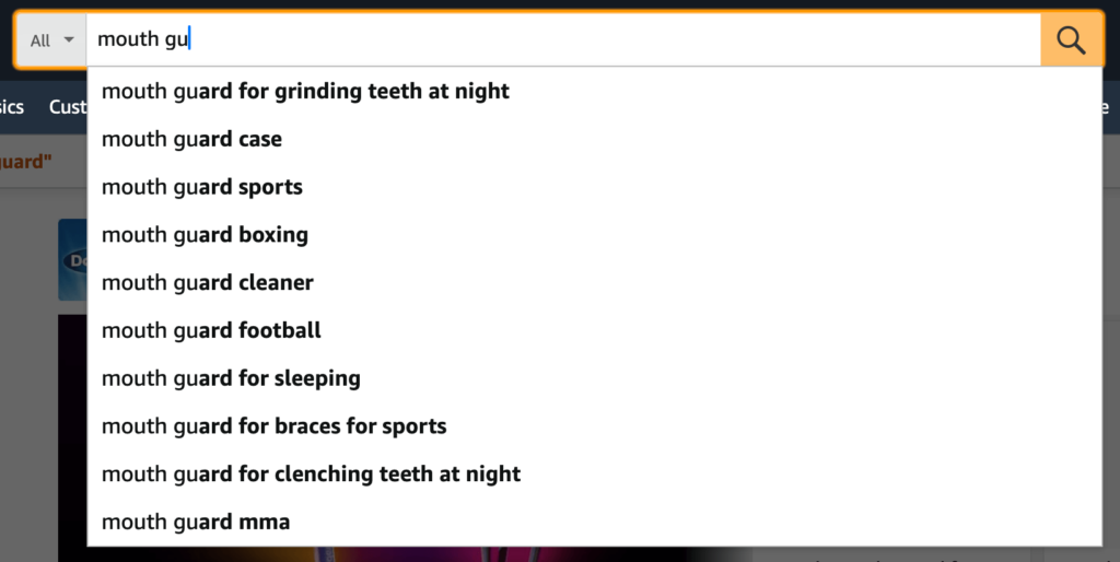 Amazon search bar with autocomplete keyword suggestions for "mouth guard", including "mouth guard for grinding teeth at night" and "mouth guard sports."